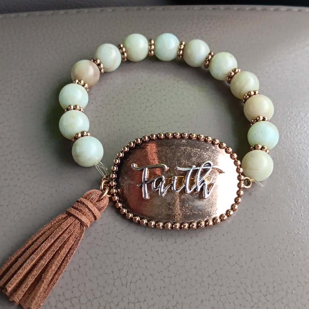 Green bracelet with brown tassel "faith"